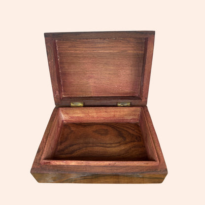 Wooden box with a lid on a white background