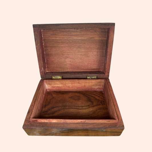 Wooden box with a lid on a white background