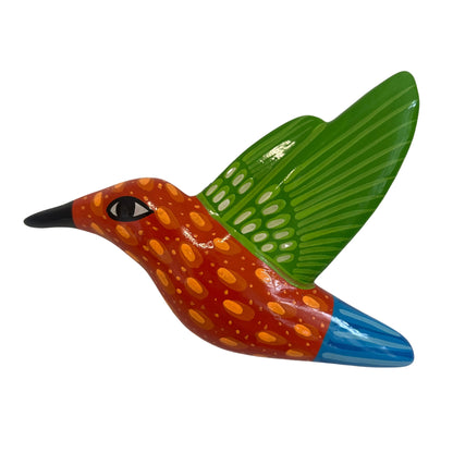 Colorful ceramic bird figurine with green wing and blue tail