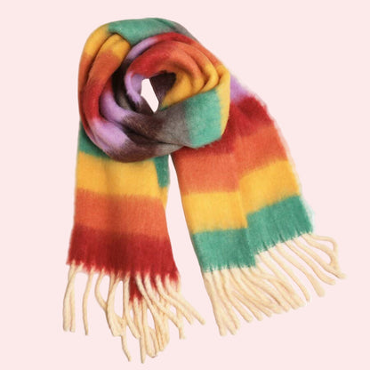 Rainbow striped scarf with fringes on a white background